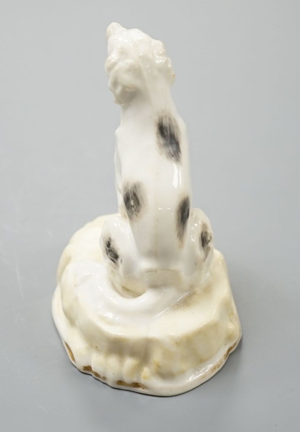 A rare Samuel Alcock porcelain model of a saluki or Persian greyhound, impressed mark 252, 8.3 cm high, Cf. Dennis G.Rice Dogs in English porcelain, colour plate 214 illustrating an identical example with incorrect facto